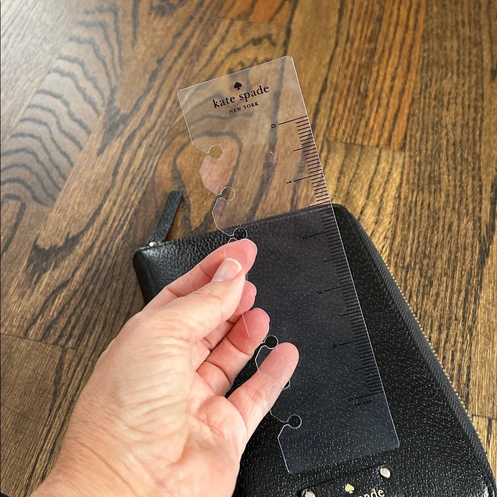 Black leather Kate Spade Wellesley zip around personal organizer/planner